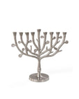 A silver aluminum Tree of Life menorah with a modern design, featuring a central trunk with branches and hooks for hanging