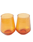 Two handblown hammered amber drinking glasses with a textured finish, placed side by side