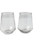 Two handblown hammered clear drinking glasses with a solid pattern and no visible contents