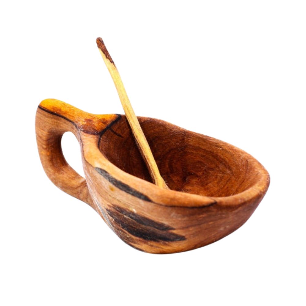 A handcarved olive wood salt pot with a spoon, with natural color variations