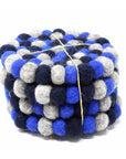 A stack of round felt ball coasters in dark blue and gray, bound together with string