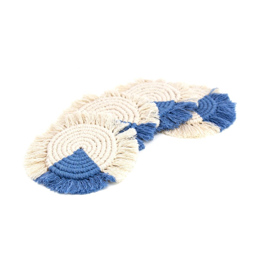 A set of four macrame coasters with a fringe, predominantly in blue and beige colors