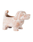 A handcrafted terracotta dog planter with a whitewashed finish, featuring decorative patterns
