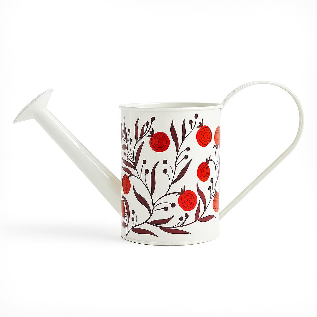 White watering can with red floral design on a white background