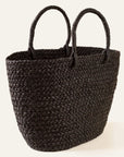 Braided raffia black day bag with handles against a white background