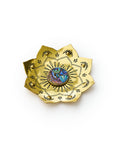 A brass tray with a lotus design and an inlaid abalone center, giving it a shimmering appearance