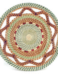 Woven basket with a multi-color pattern on a white background