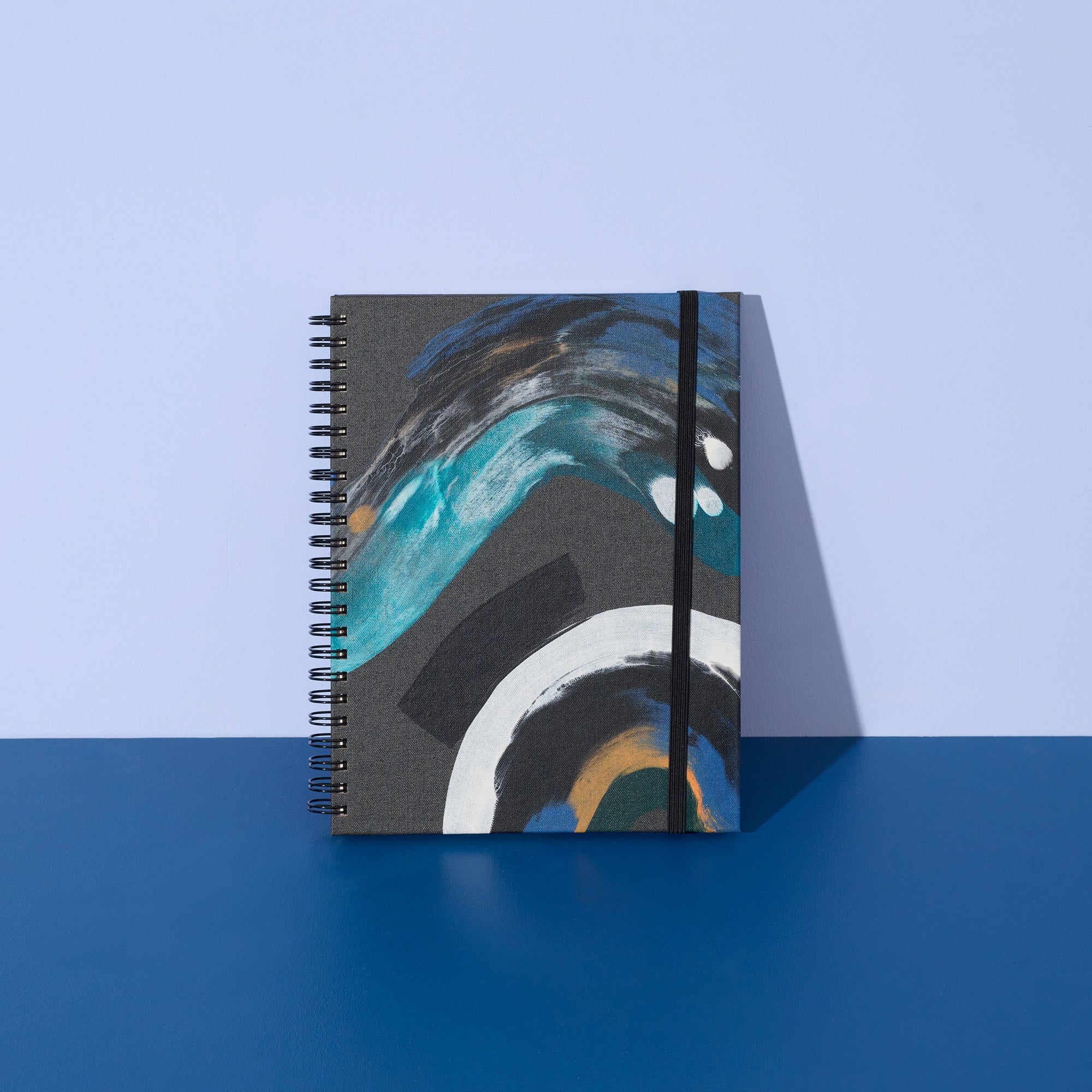 Notebook with abstract design on a blue background