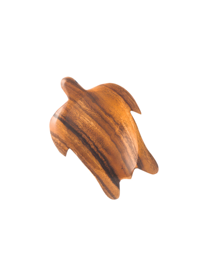 A small, hand-crafted acacia wood dish in the shape of a turtle