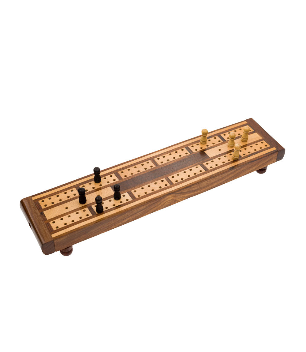 A traditional wooden cribbage board with carved-out storage for game pieces, featuring a patterned design with black and gold elements.