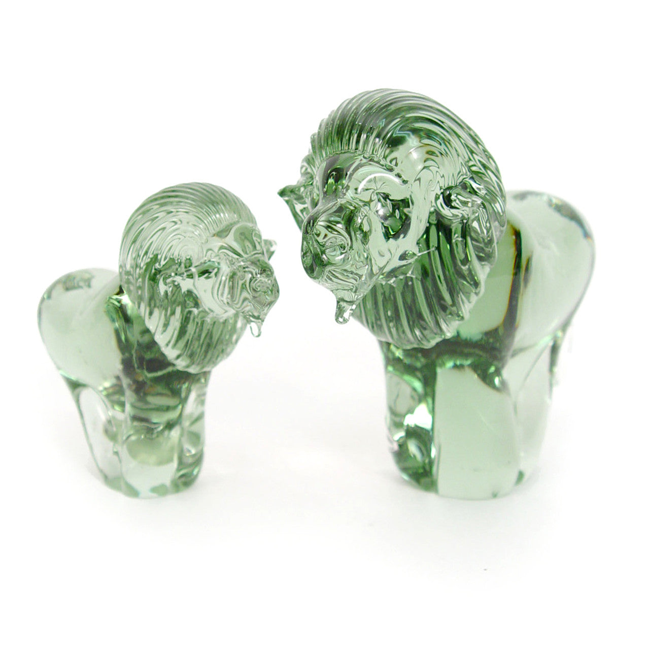 Two clear glass lion sculptures made from recycled glass, with smooth and polished finishes
