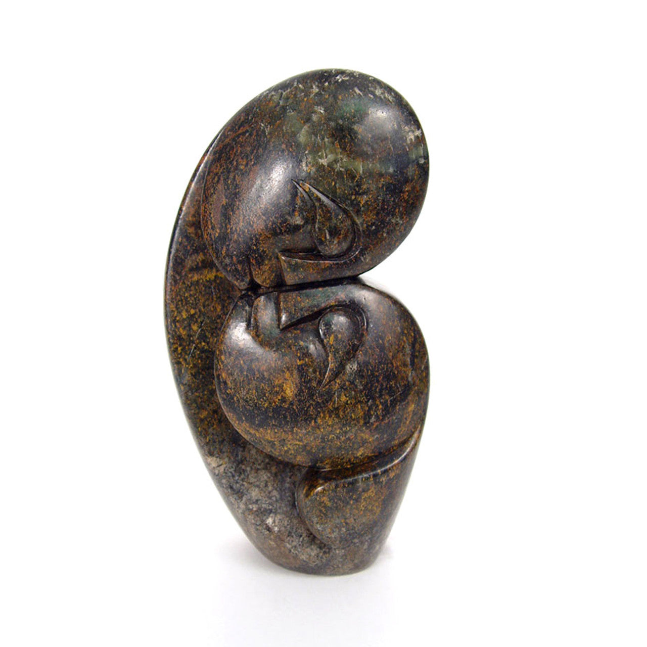 A stone sculpture representing two figures in an intimate embrace, carved from serpentine stone with variations in brown and green hues.