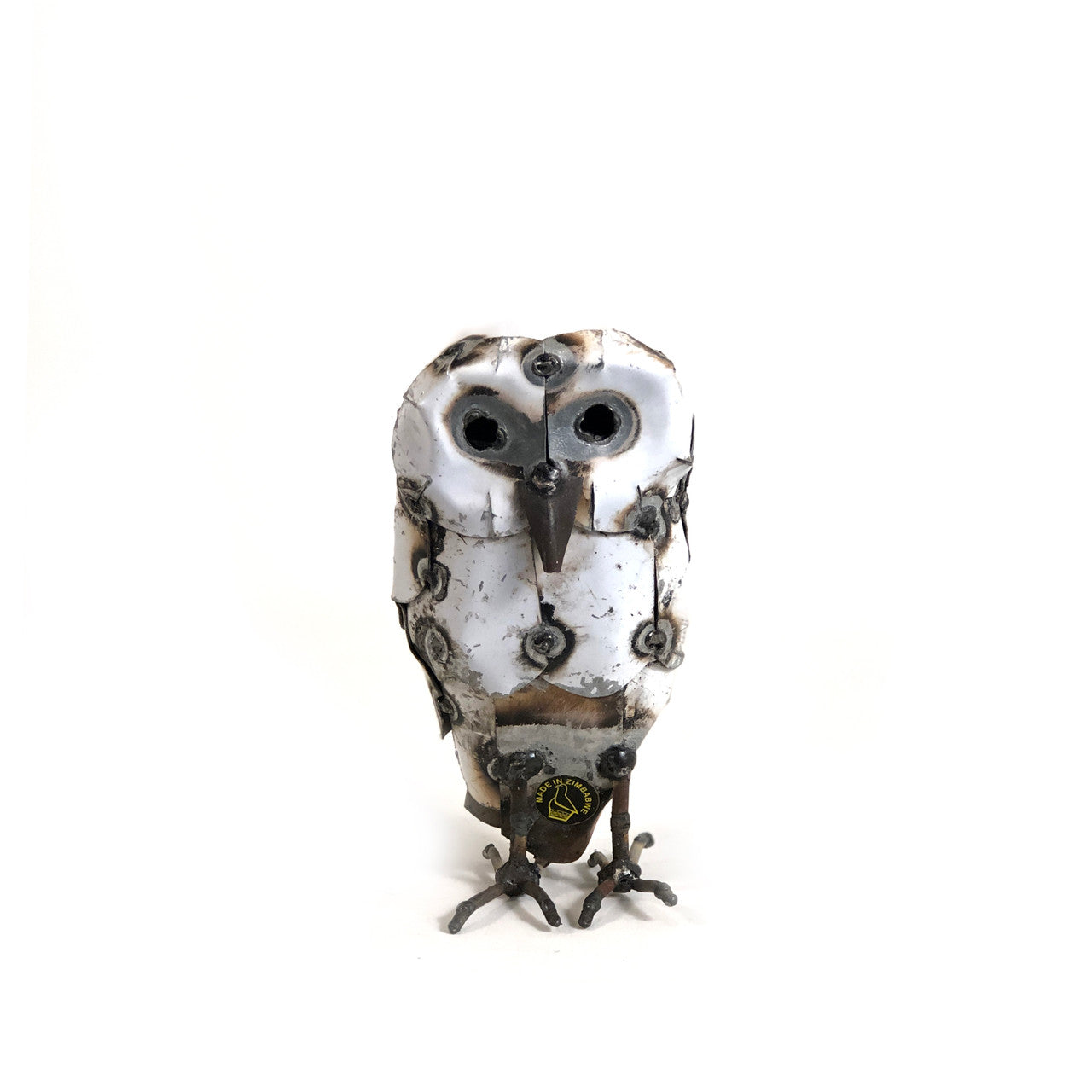 Decorative metal owl sculpture on a white background