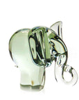 A recycled glass elephant figurine with a clear glass trunk and a smooth and polished finish