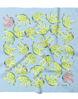 Silk bandana with green and pink tiger pattern on a light blue background