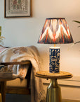 Decorative lamp on a side table in a cozy living room setting