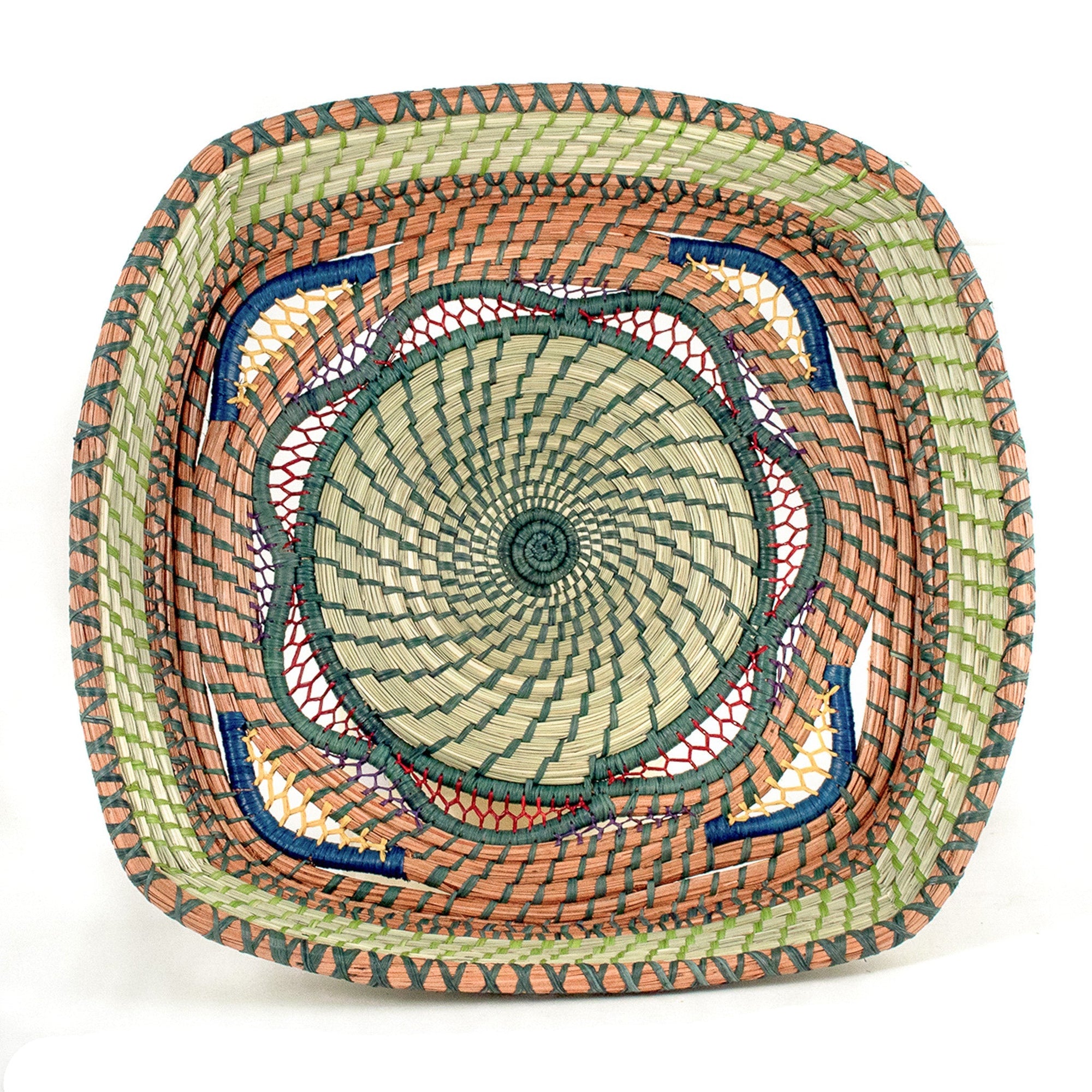 Decorative woven basket with concentric circle pattern on a white background