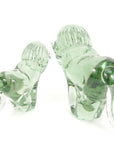 The back of two clear glass lion sculptures made from recycled glass, with a smooth and polished finishes