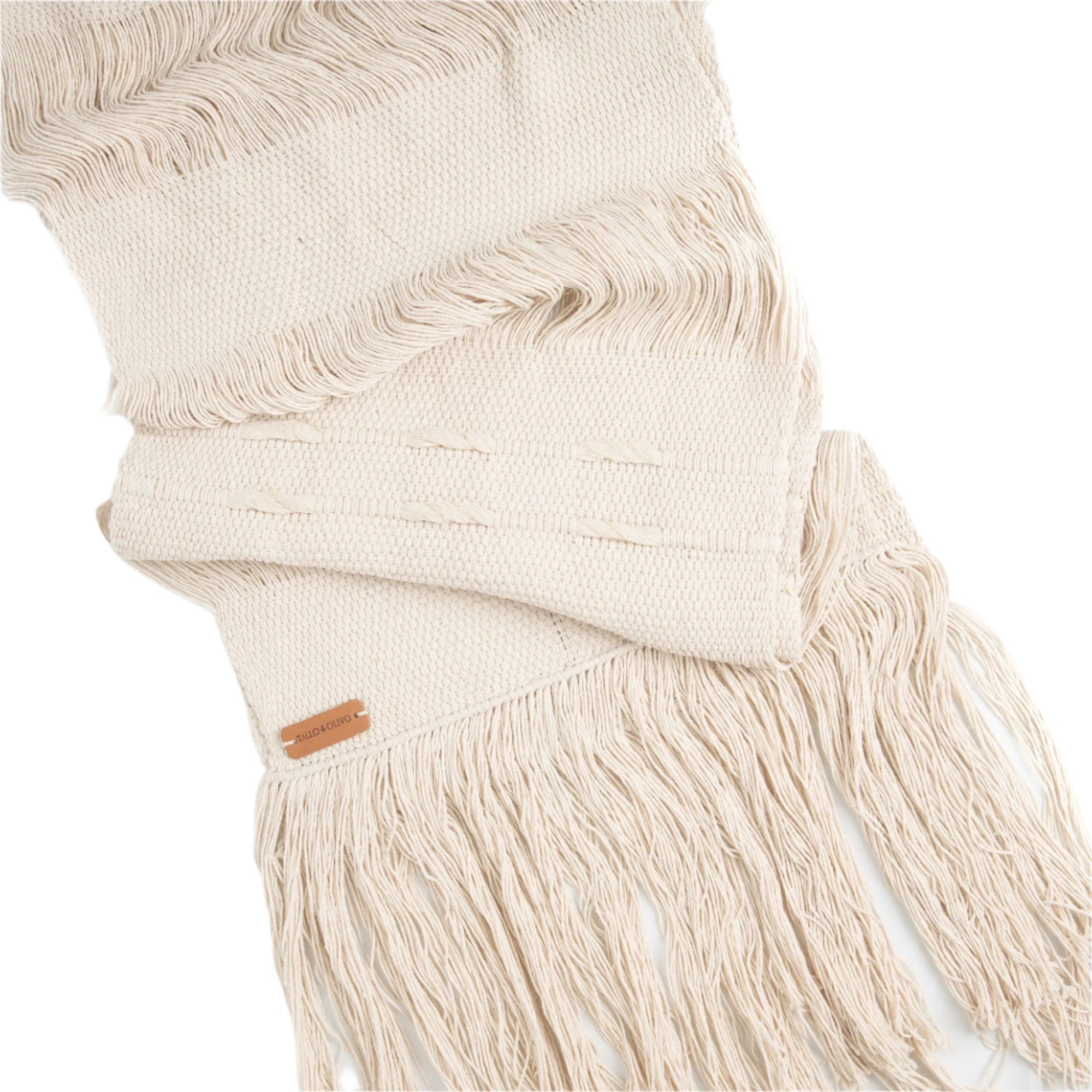 A white rectangular table runner with fringed edges, displayed on a white background