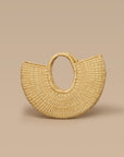 A beige half-moon shaped handbag made from elephant grass, with an open top and two handles.