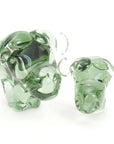 Two glass buffaloes on a white background