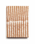 Notebook with brown and white striped pattern on a white background