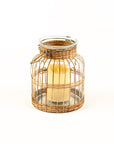Wicker lantern with a candle inside on a white background