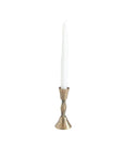Bronze candle holder with a white candle on a white background