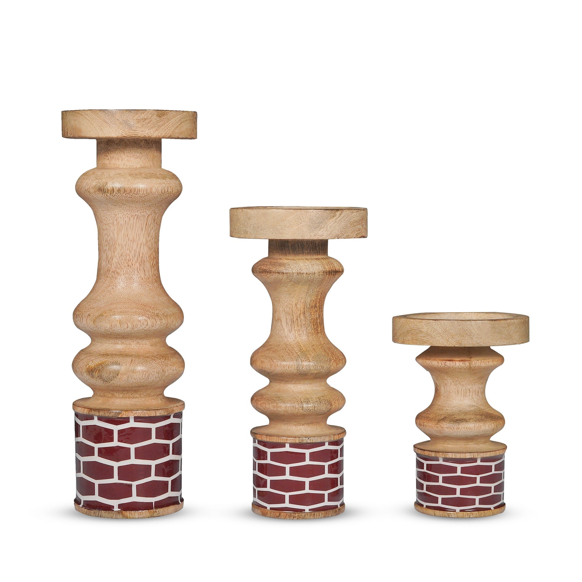 Three wooden candle holders with decorative bases on a white background