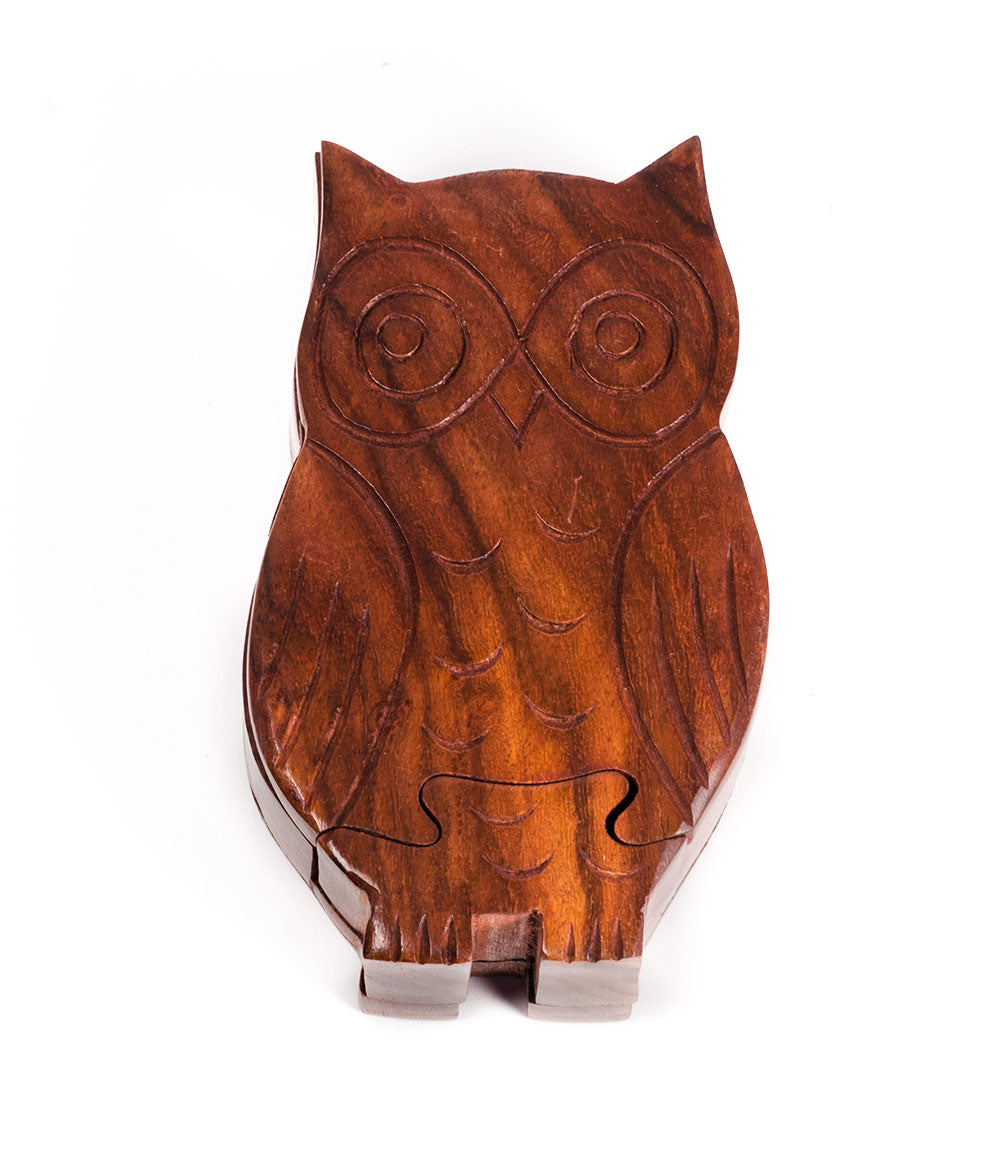 Ethically hand-carved sheesham wood puzzle box in the shape of an owl with a visible puzzle pattern on the front.
