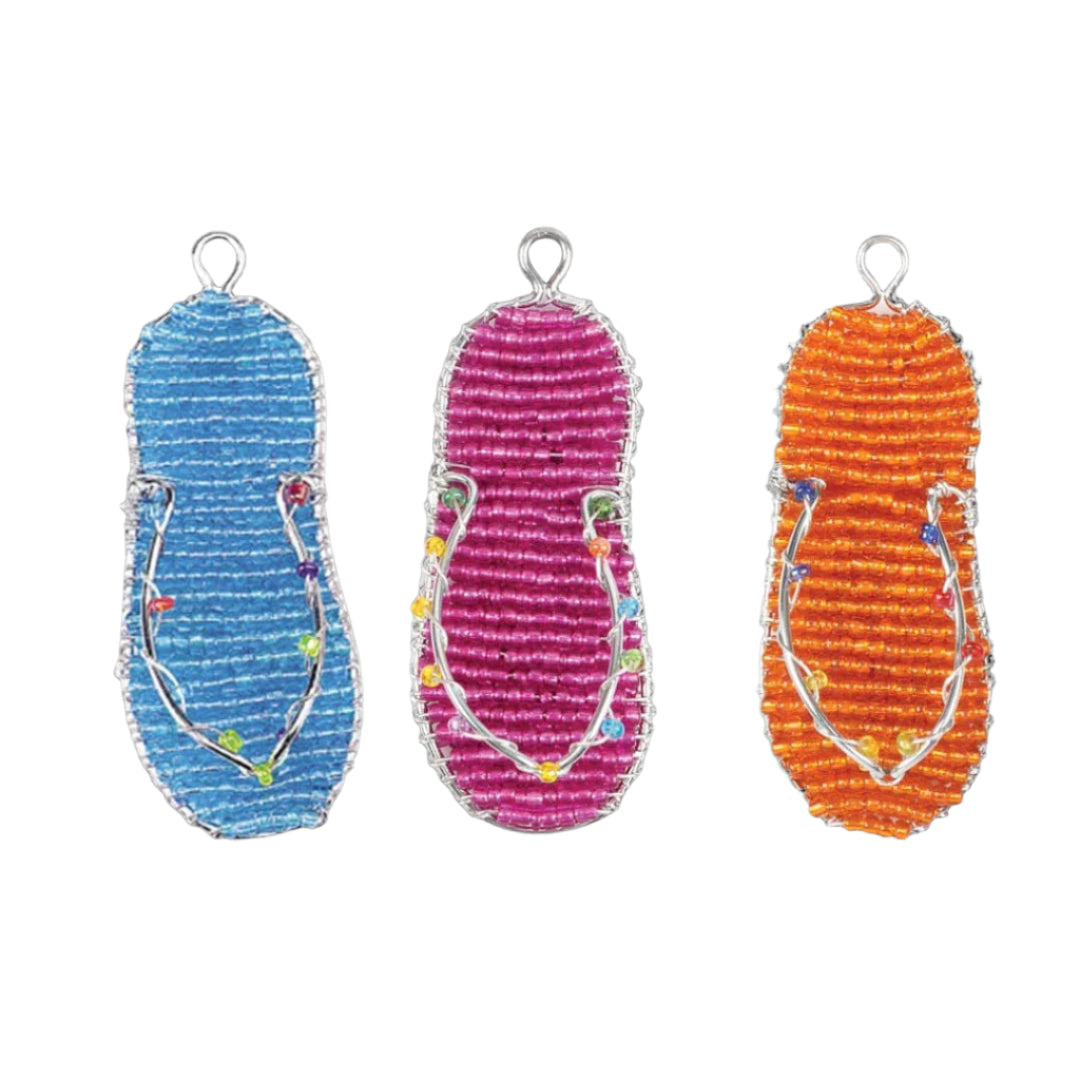 Three colorful sandal-shaped key rings on a white background