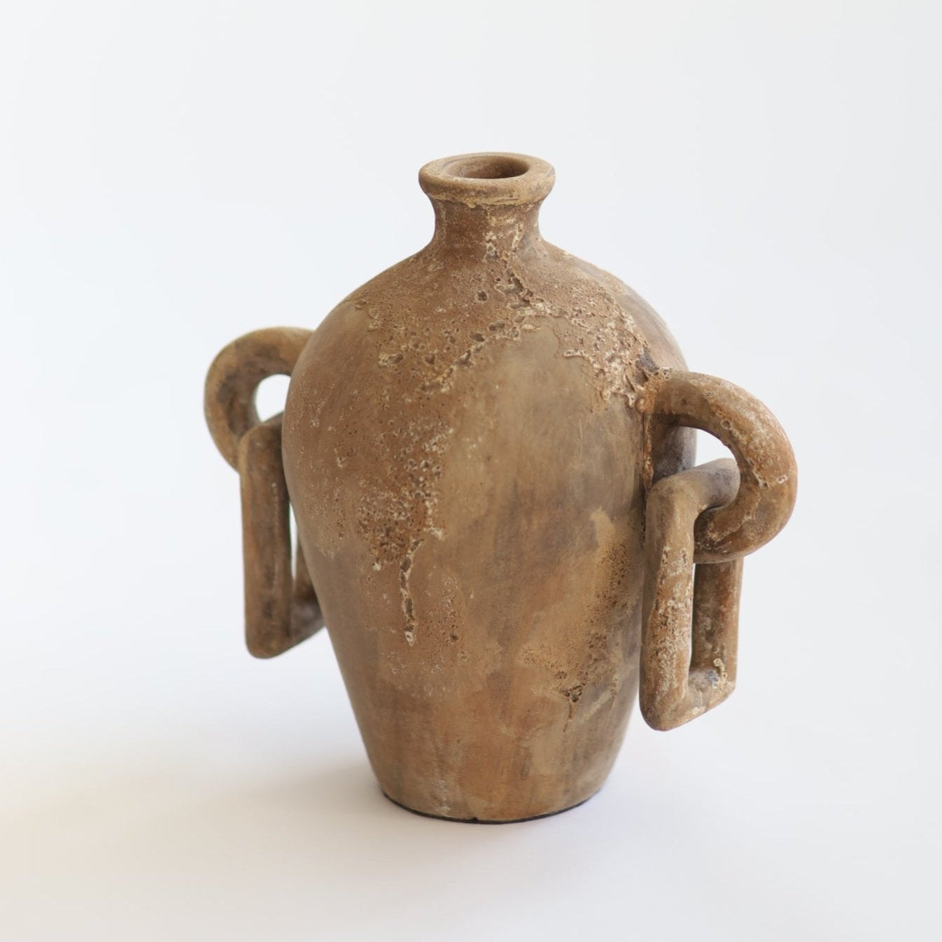 A brown terracotta clay vessel with a spherical base and side handles, displaying a textured finish.