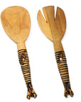 A pair of hand-carved wooden salad tongs with a striped animal design on the handle, resembling a zebra
