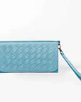 Blue woven wristlet wallet with a wrist strap on a white background