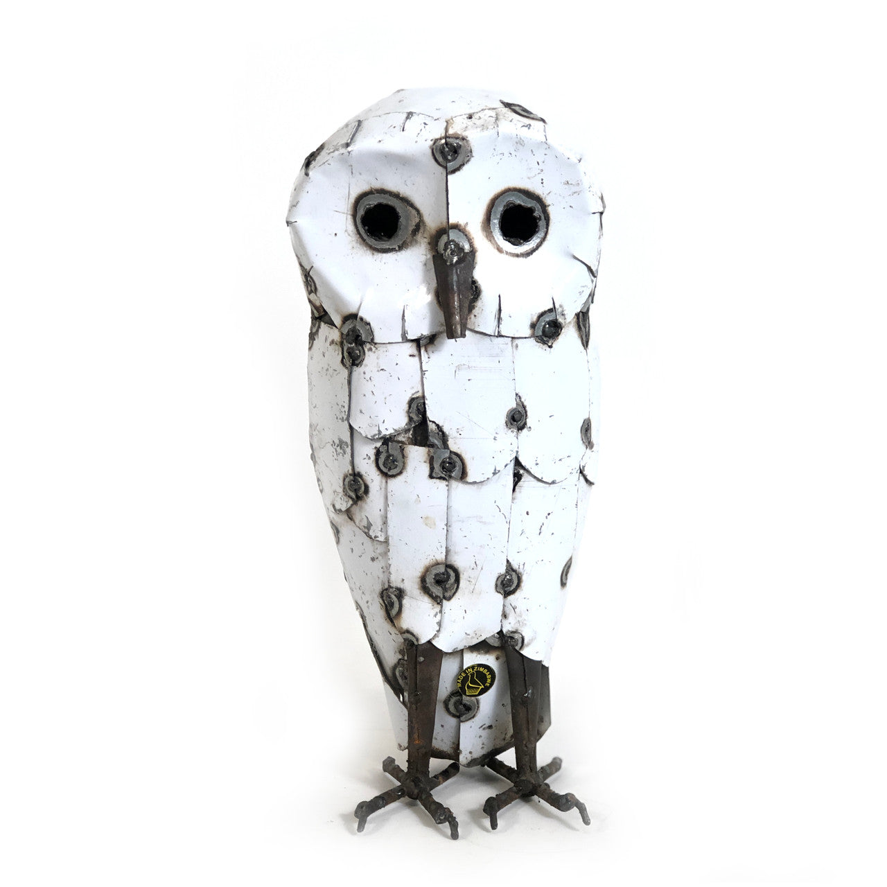 Decorative owl sculpture with white feathers and black accents on a white background