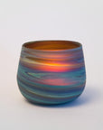 Multicolored glass vase on a white background