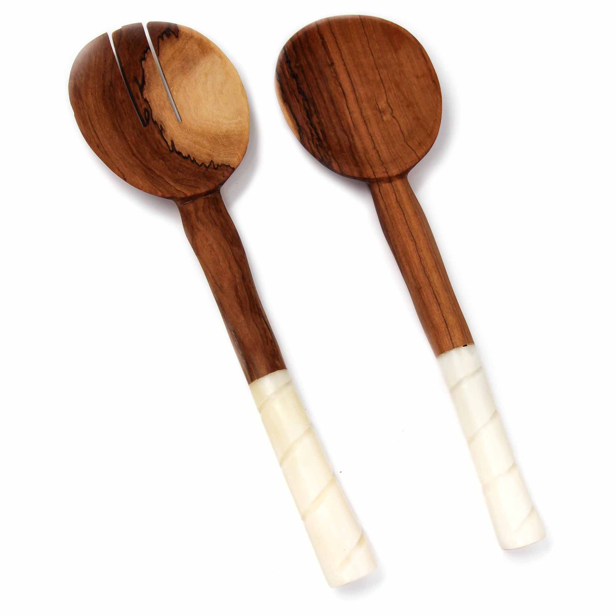 A pair of olive wood salad servers with white bone handles featuring etching design details