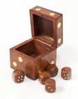 Wooden dice box with gold accents and five wooden dice on a white background