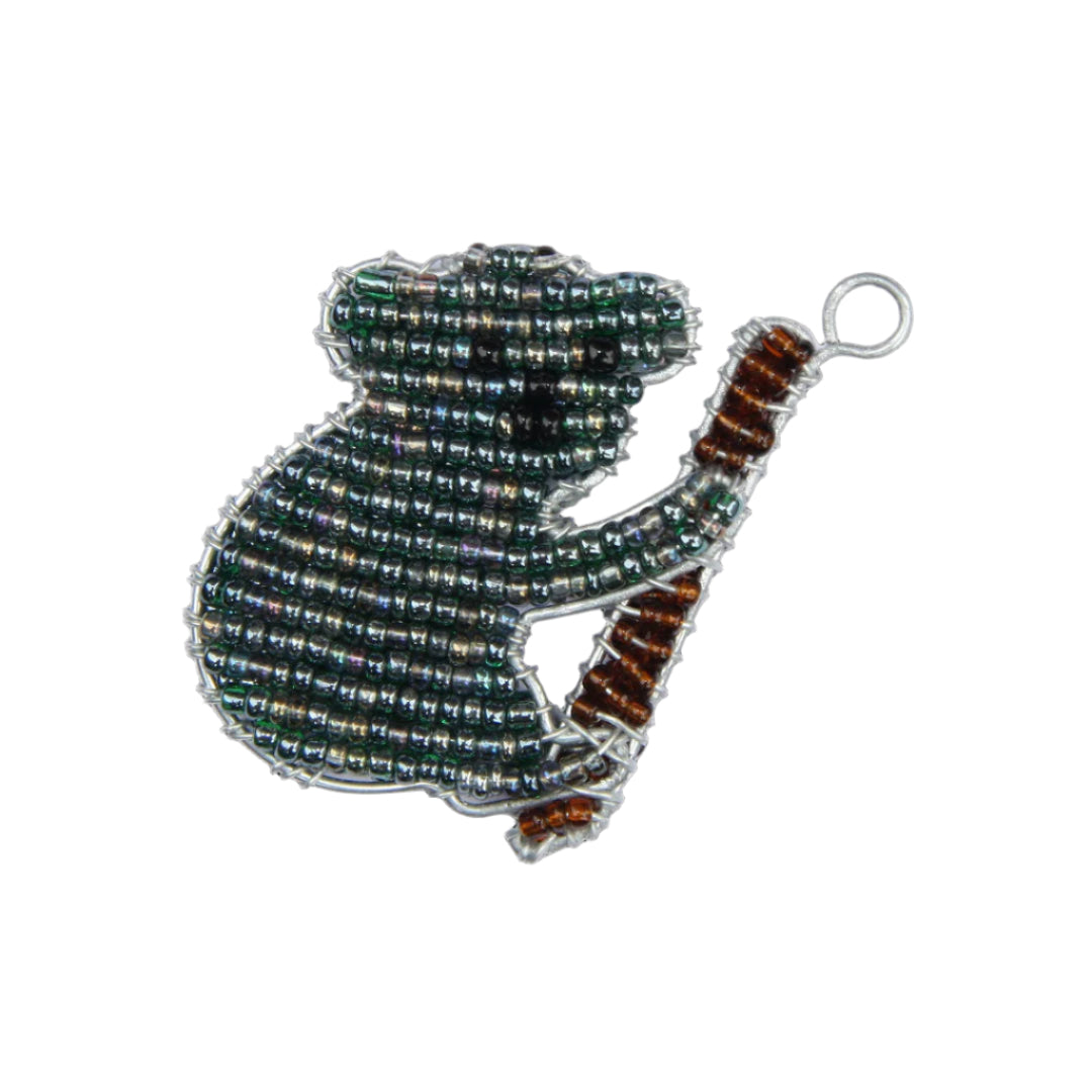 Decorative keychain shaped like a koala with beads on a white background