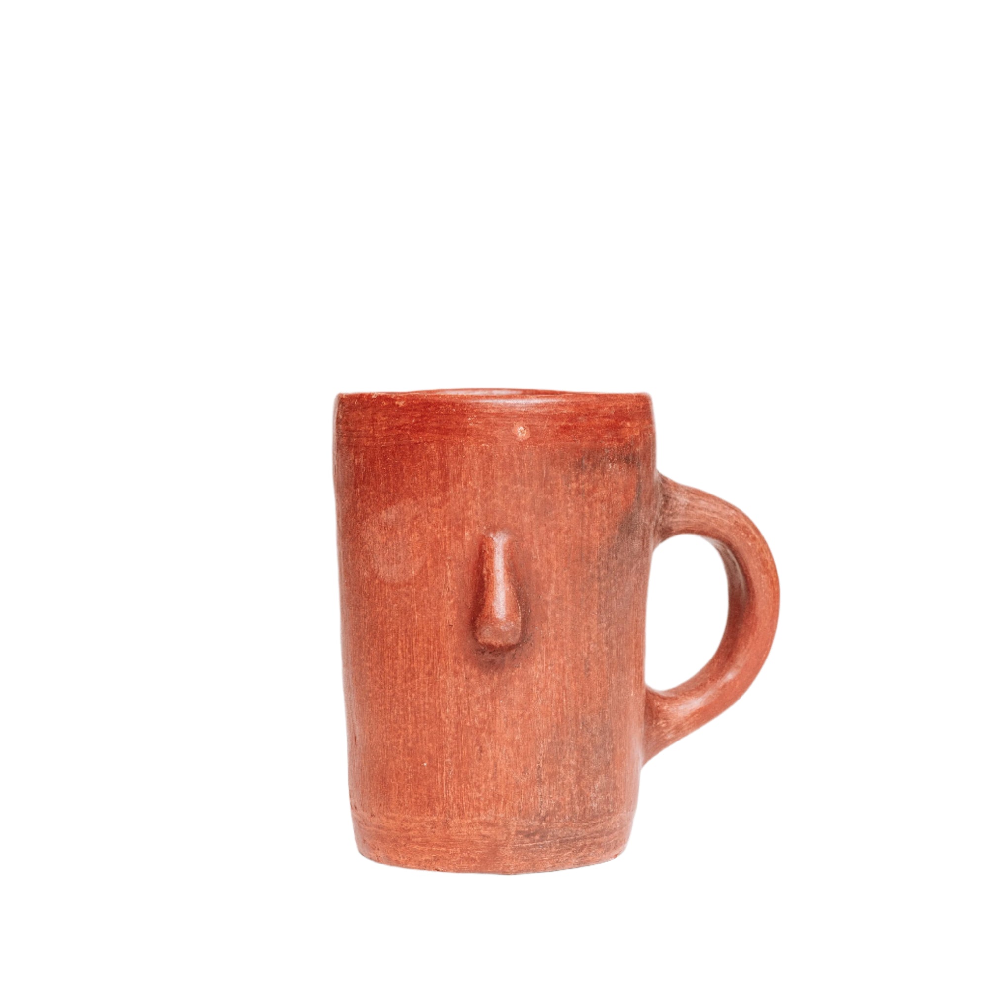 A brown ceramic mug with a protruding face and a handle, on a white background