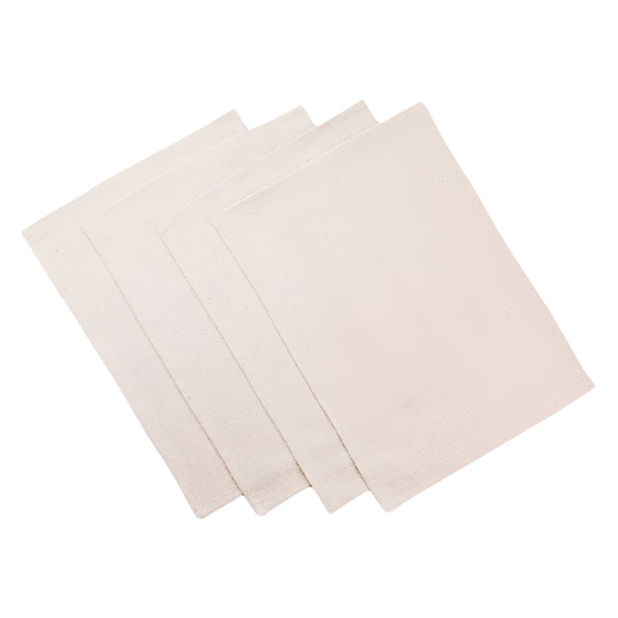 A set of four beige rustic placemats made with upcycled denim and cotton, displayed on a neutral background