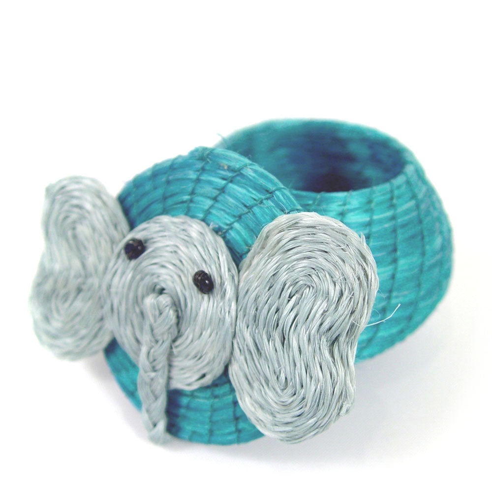 A handwoven turquoise elephant-shaped lidded basket made of sisal, intended for storing small items