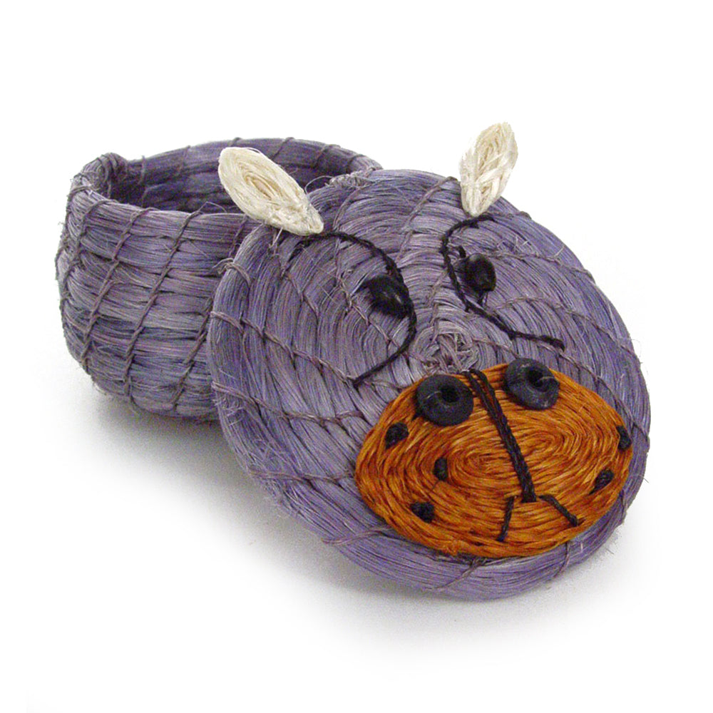 Handwoven lidded basket in the shape of a hippo with purple body and orange face details with the lid off