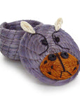 Handwoven lidded basket in the shape of a hippo with purple body and orange face details with the lid off