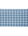 A set of folded terry kitchen towels in ecru and blue denim colors with a grid pattern