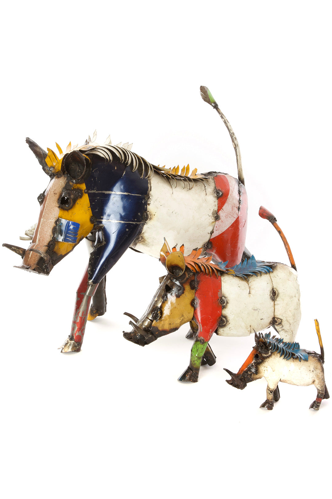 Three colorful wart hog sculptures with decorative elements on a white background