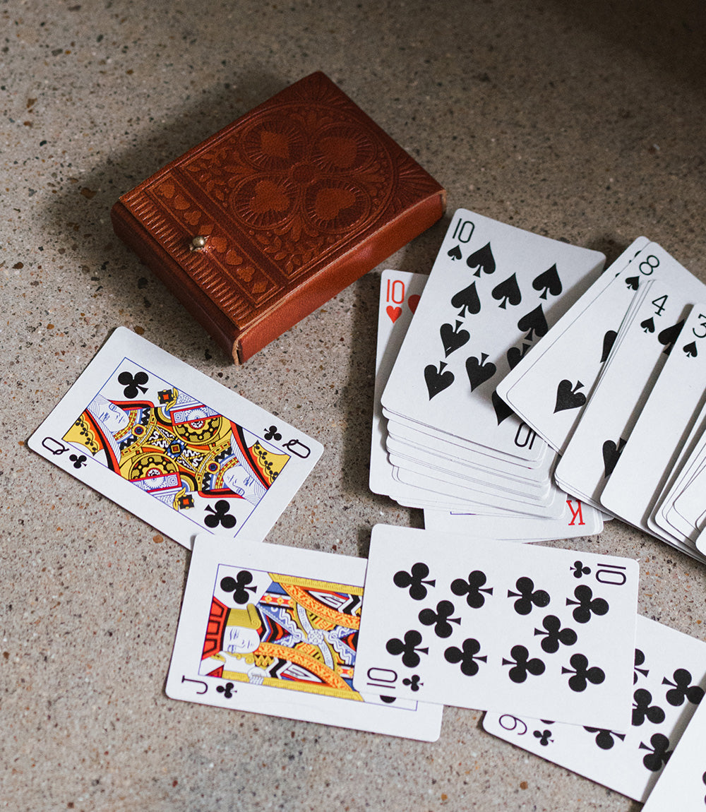 Playing cards on the floor - dice and card games collection at Better World Bio