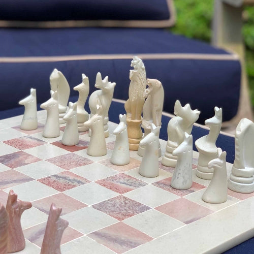 Handcrafted chess pieces on a chess board - chess set collection at Better World Bio