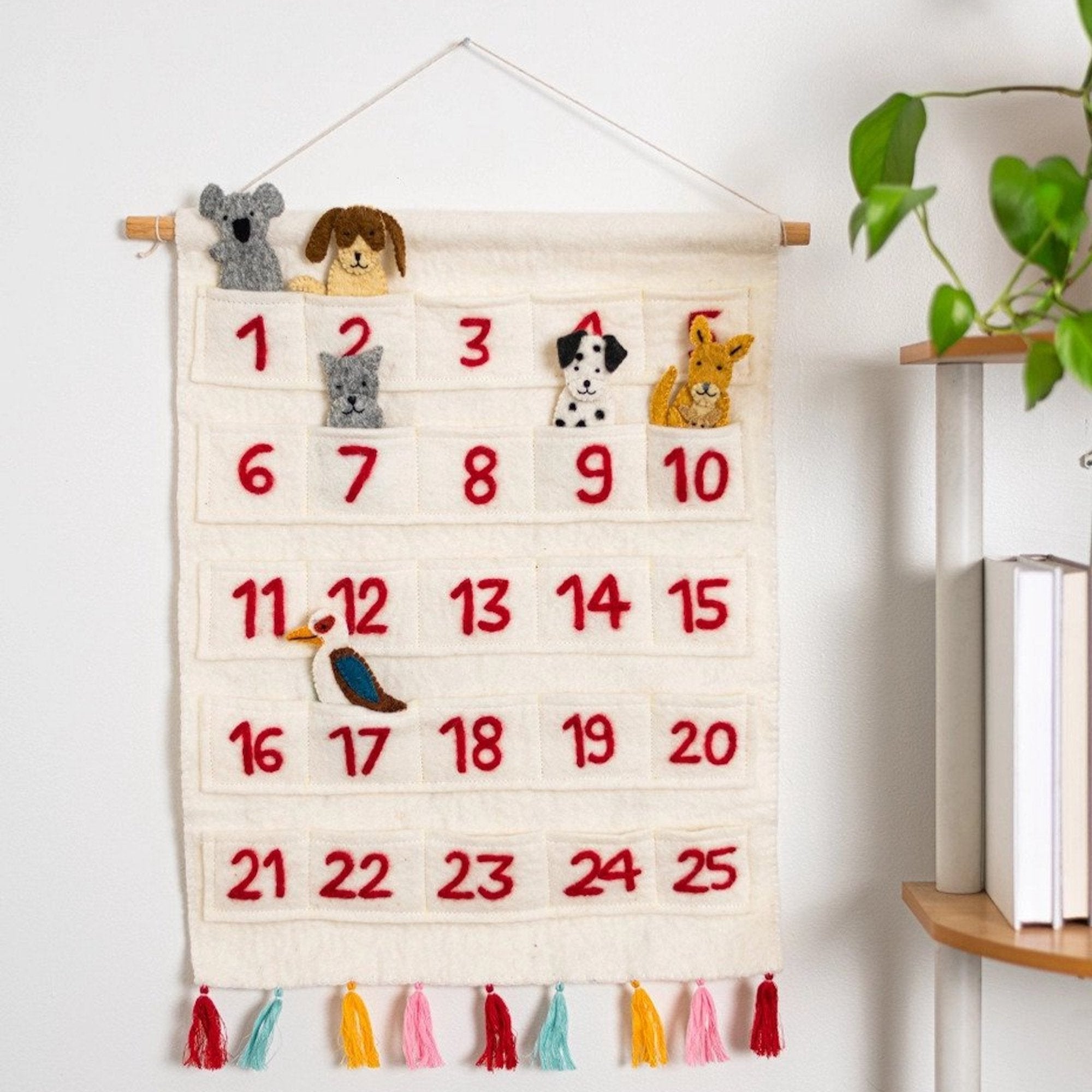 Handmade felt advent calendar with colorful pockets, a festive accent for holiday celebrations throughout the year.