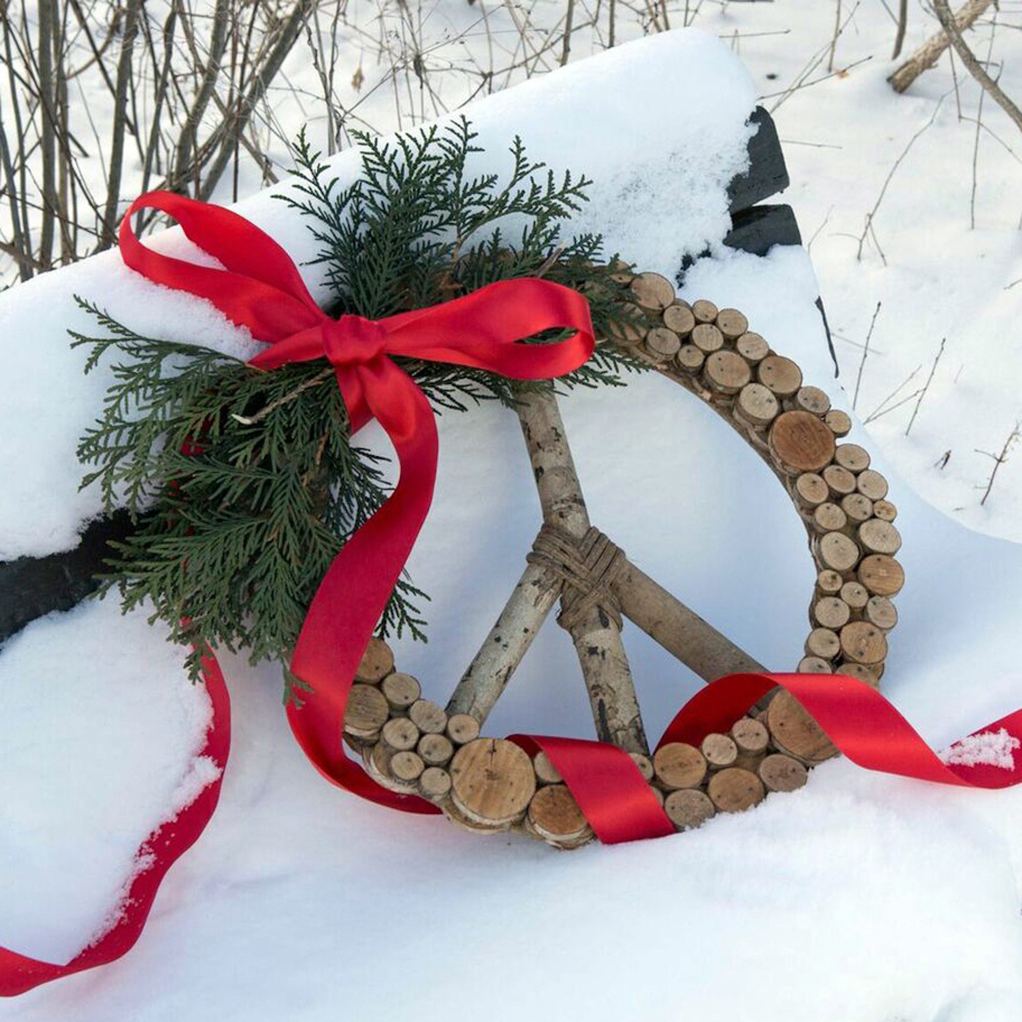 Handcrafted wreath with a Christmas garland on the snow — Wreaths & Garlands at Better World Bio